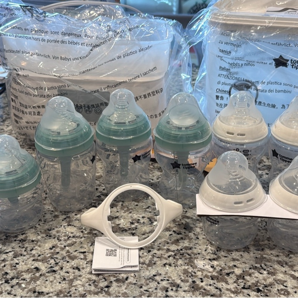 Set of Baby Bottles with Teal and White Caps tommee with sterilizer
